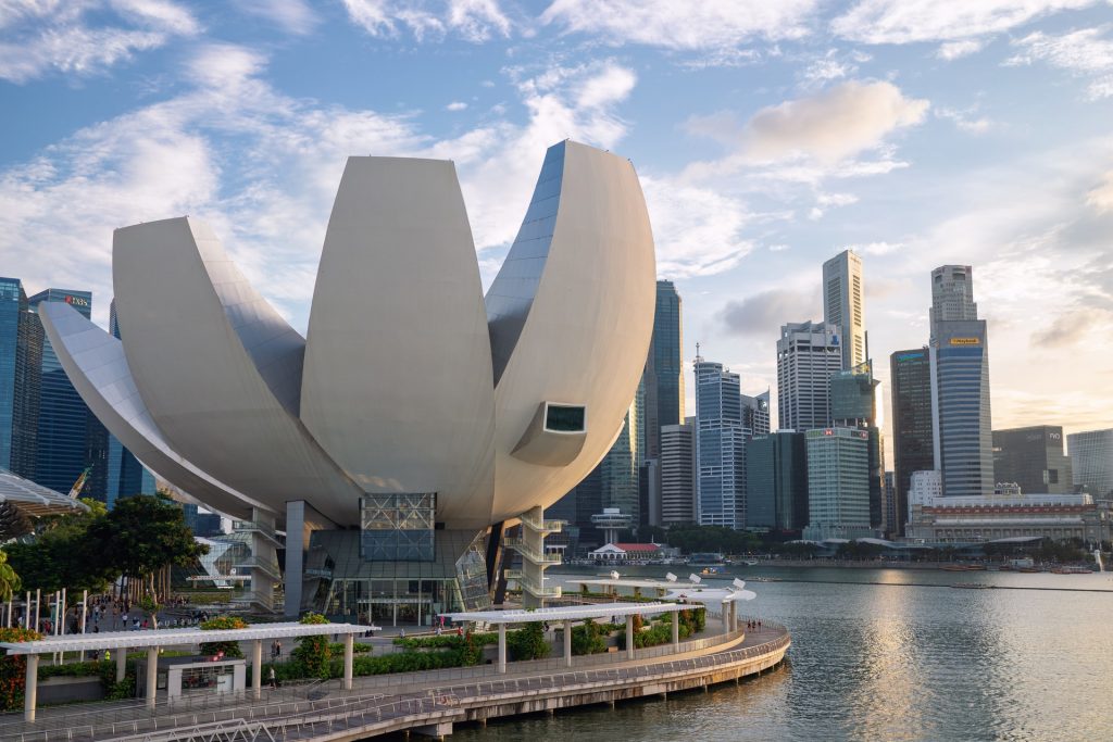 artscience building of singapore on the harbour with city skyline in the background