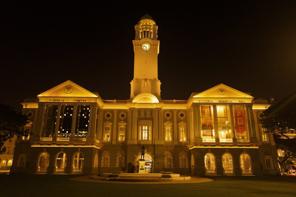 facade lit up at night of victoria concert hall