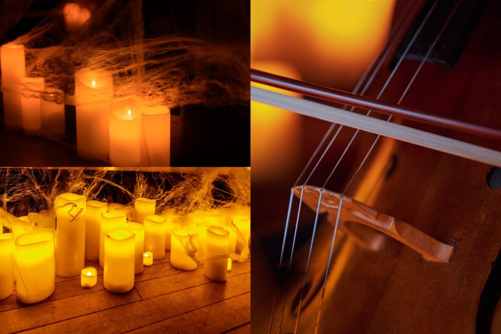 closeup of candles and a cello 